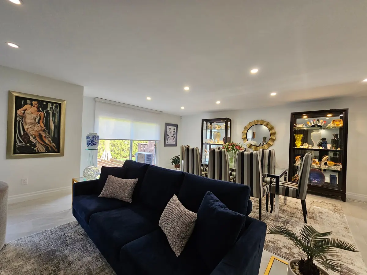 Living and dining room with a patio door roller shade